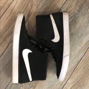 Nike high top sneakers.